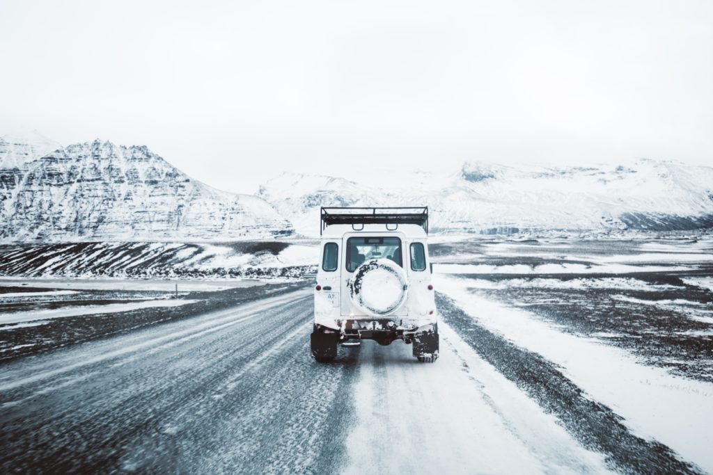 white car on road during winter