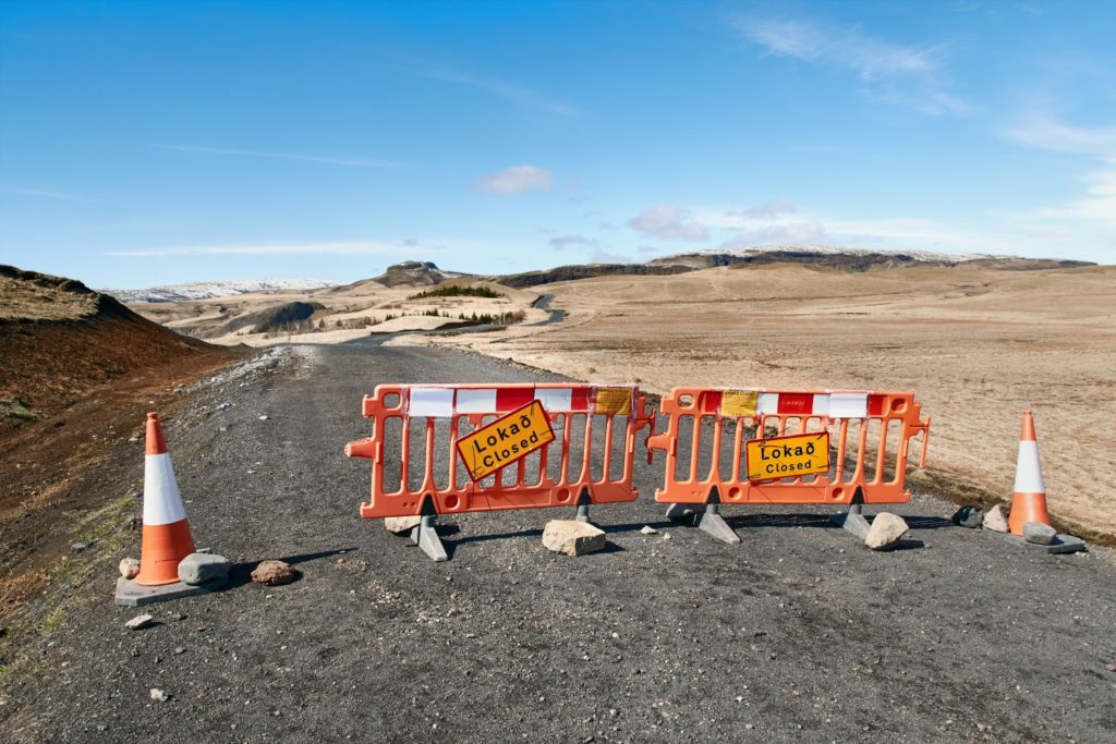 closed road sign in Iceland due to natural disaster damages