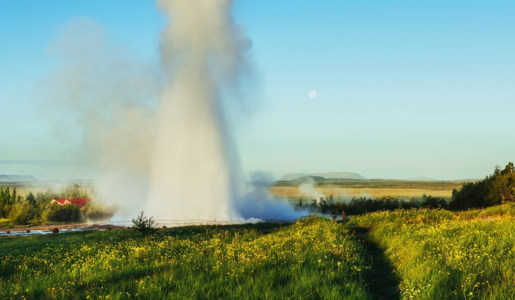 Fantastic sunset Strokkur geyser eruption in Iceland. Fantastic colors