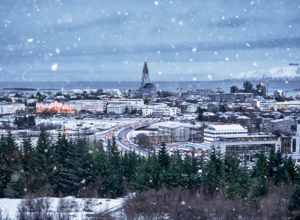 Reykjavik, Iceland, Europe, December 24. Aerial cityscape during a snowstorm at Christmas
