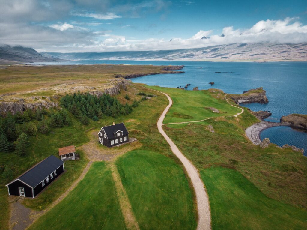 Aerial view of houses and cars on seashore, snaefellsnes, iceland