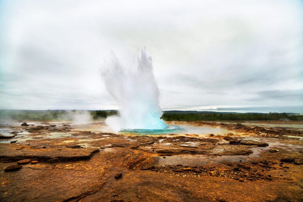 Geyser eruption in a beautifil Iceland landscape, Europe.